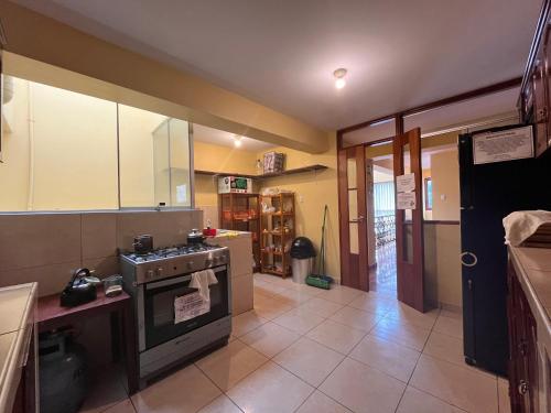 Kuchyň nebo kuchyňský kout v ubytování El Parche Rutero Hostel