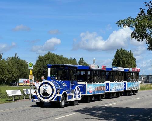 a small trolley car on the road at Ferienhaus Enjoy in Büsum