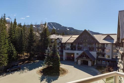 an aerial view of a large building with a driveway at The Aspens by Whiski Jack in Whistler