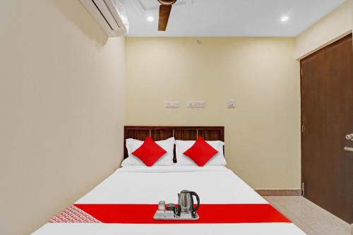 Ένα ή περισσότερα κρεβάτια σε δωμάτιο στο Hotel O GN Nelli Suites