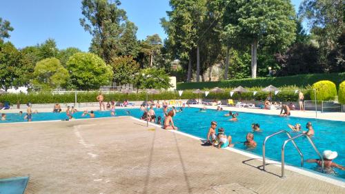 a group of people in a swimming pool at Serra da Estrela - Casa Castro in Gouveia