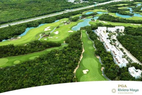 an overhead view of a golf course at a resort at Oceanfront Paradise In Akumal Beach Access in Akumal