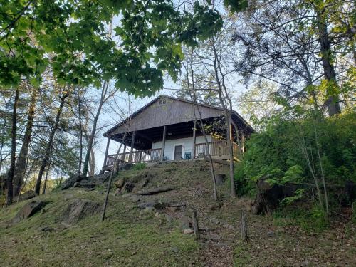 a small house on top of a hill at Graves Mountain Farm & Lodges in Syria