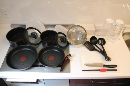 a bunch of pots and pans sitting on a counter at ecrin in Awaji