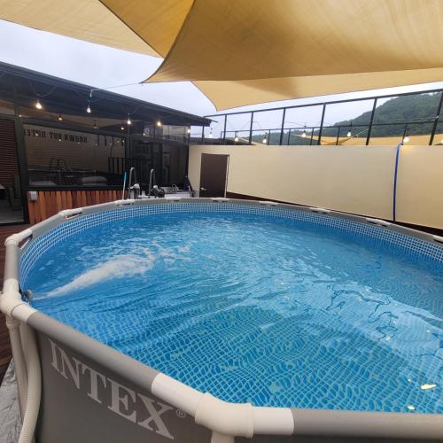 a large swimming pool on a cruise ship at Mokpo Brown Dot Hotel Namak in Mokpo