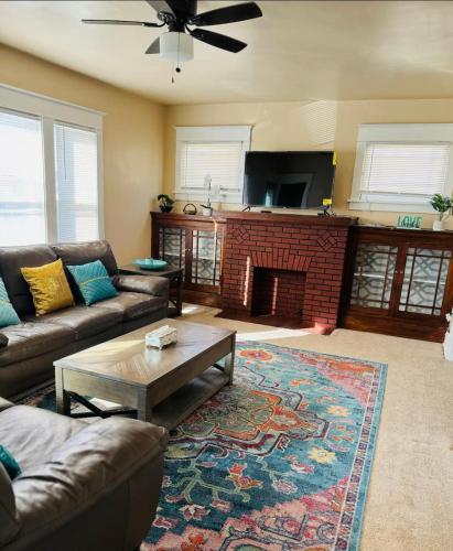a living room with a couch and a fireplace at Beautiful 3 bed room apartment in Buffalo