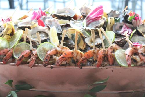 a plate of food with lobsters and lime slices at Midnight Hotel, Autograph Collection in Canberra