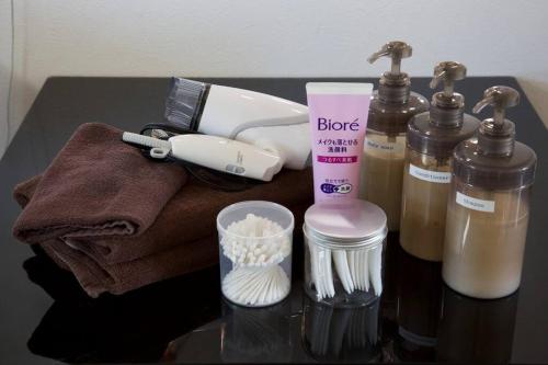 a table with a bunch of products on it at Mishuku Onna 301 in Baba