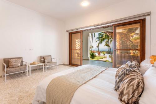 Ένα ή περισσότερα κρεβάτια σε δωμάτιο στο Villa Serene