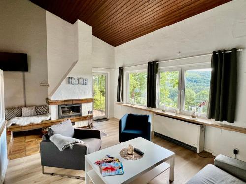 a living room with a couch and a table at Ferienhaus Seeblick in Biersdorf