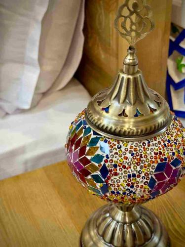 a glass dome vase on a table at MERITON Boutique in Bukhara