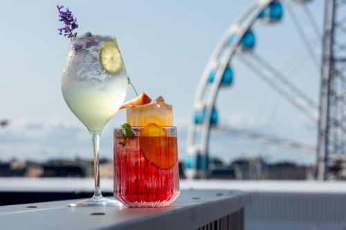 a drink sitting on top of a table next to a drink at Solo Sokos Hotel Pier 4 in Helsinki