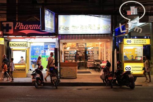 a group of people riding motorcycles in front of a store at The Central Pattaya High Floor, Pattaya City in Pattaya Central