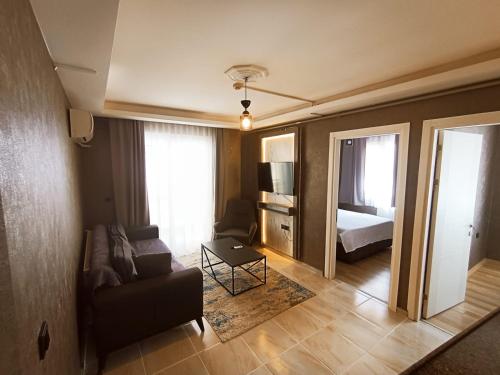Ένα ή περισσότερα κρεβάτια σε δωμάτιο στο Aslan Suit Otel