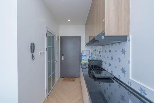 a kitchen with a sink and a stove at Lovely Condomnium on 10th floor in Nairobi