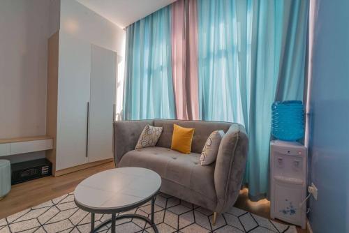 a living room with a couch and a table at Lovely Condomnium on 10th floor in Nairobi