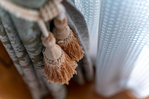 a close up of a stuffed animal on a curtain at ガーデンテラス伊豆高原 in Futo