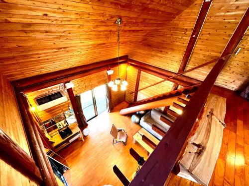an overhead view of a living room in a cabin at LOG AMAMl 1棟貸切ログハウス in Setouchi