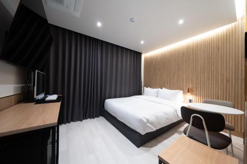 Postel nebo postele na pokoji v ubytování Gapyeong hotel GRAZIE
