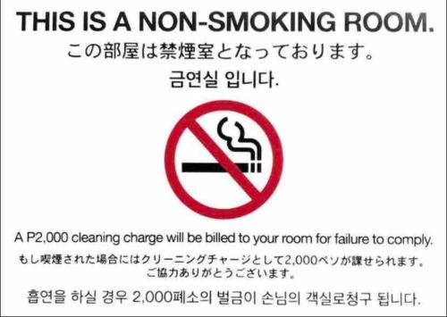 a sign that says this is a non smoking room at DaLei 1-319 Sleeps 8pax at Marina Spatial Condominium in Dumaguete City in Dumaguete
