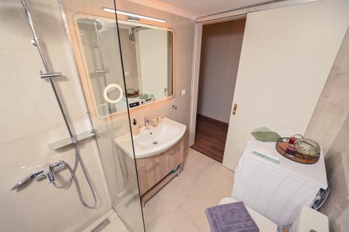 a bathroom with a shower and a sink at Elegant Apartment Preveza in Preveza