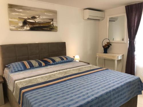Postel nebo postele na pokoji v ubytování Apartment Ema