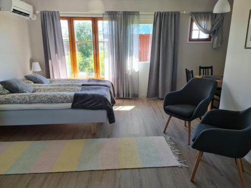 Postel nebo postele na pokoji v ubytování Kierinki Village Lomahuoneisto