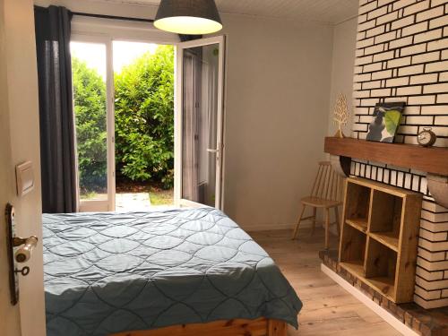 Postel nebo postele na pokoji v ubytování Chez Loulou chambre indépendante