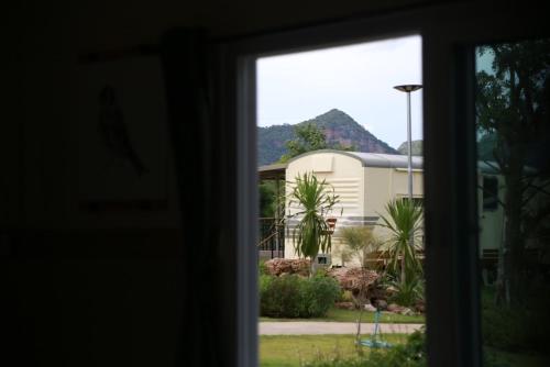 a view of a house from a window at Nex Station Kanchanaburi in Kanchanaburi