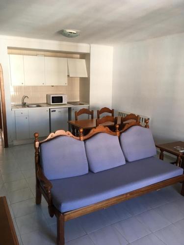 a couch with three pillows on it in a kitchen at Sol y Mar Apartments in Cala Bona