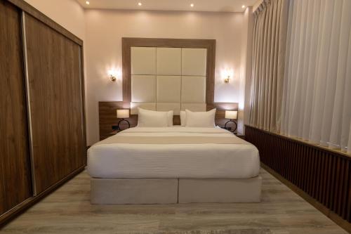 Postel nebo postele na pokoji v ubytování Jeddah Homes Boutique Hotel