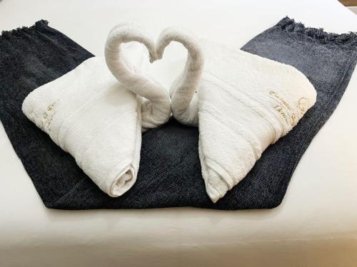 En eller flere senge i et værelse på Exclusive Stays @ Rea's Oceanic Hotels