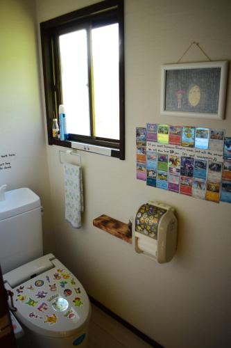 Koupelna v ubytování OMOLOSO Hostel　オモロソウ ホステル