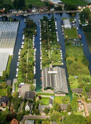 an aerial view of a marina with a bunch of boats at Glamping at the water, close to Amsterdam in Aalsmeer