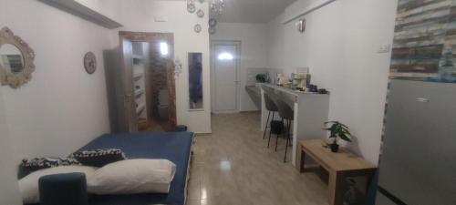 a bedroom with a bed and a sink in a room at 12 senses faliraki sea view in Faliraki