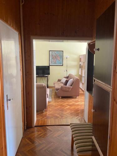 a living room with two chairs and a couch at Peaceful home Suvacha in Kikinda