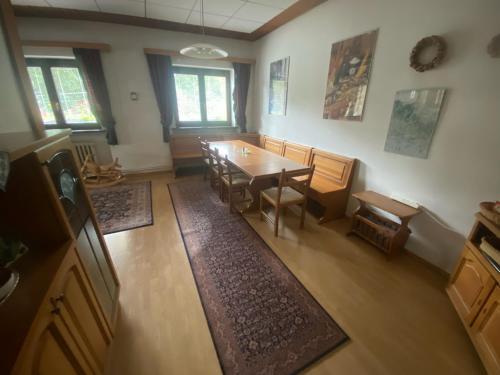 an overhead view of a dining room with a table and chairs at Dům U potoka in Rudník
