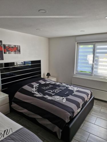 a bedroom with a large bed in a room at Joli Studio in Metz