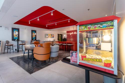 a restaurant with a room with a clown game at Oakwood Studios Sukhumvit Bangkok in Bangkok
