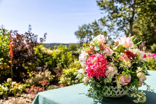 a bouquet of flowers sitting on top of a table at Ferienwohnung Schwarzwaldglück in Lenzkirch
