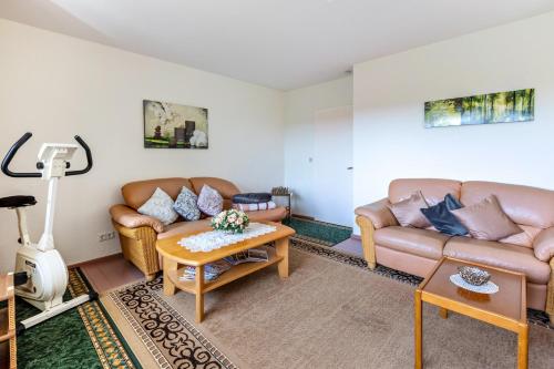 a living room with two couches and a table at Ferienwohnung Schwarzwaldglück in Lenzkirch
