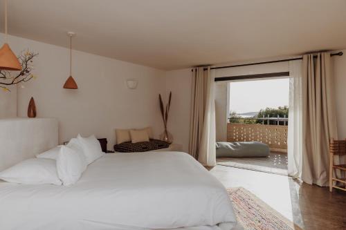 Postel nebo postele na pokoji v ubytování VILLA FLAKA Boutique Hôtel Confidentiel et Convivial
