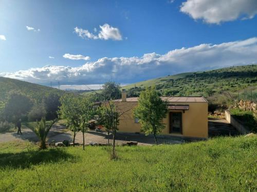 a house in the middle of a field at Il Poderino di Civitavecchia in Civitavecchia