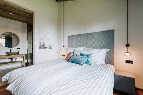 Cama o camas de una habitación en Almchalet - Luxus am Fuße der Koralpe