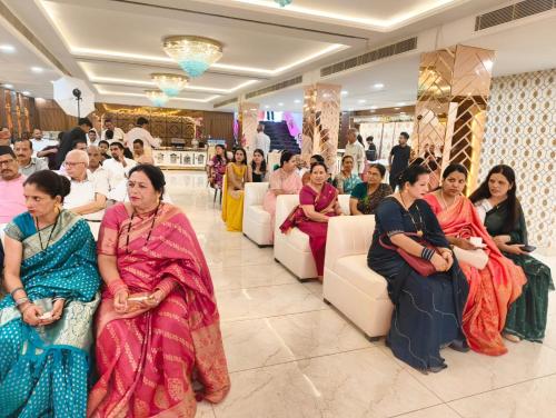a group of people sitting in a room at Hotel W Grand - A Boutique Hotel in Haridwār