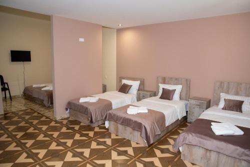 Postel nebo postele na pokoji v ubytování Magic View Hotel