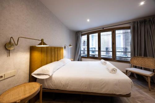 a bedroom with a large bed and a window at Apartamento Turístico Royal, by CartagenaSpain in Cartagena