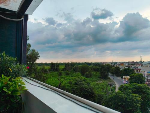 a view of a city from a balcony at Hotel W Grand - A Boutique Hotel in Haridwār