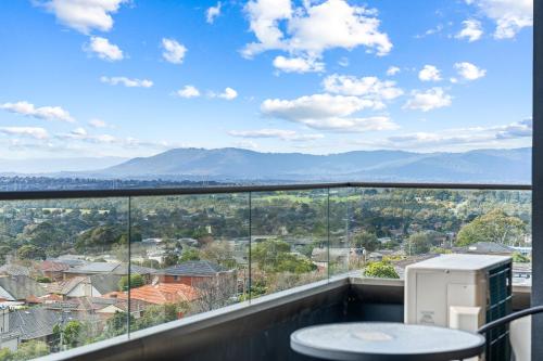 a balcony with a view of a city at Skygarden On The Glen in Glen Waverley