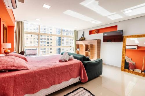 a bedroom with a large bed and a mirror at Aconchego em sampa in São Paulo